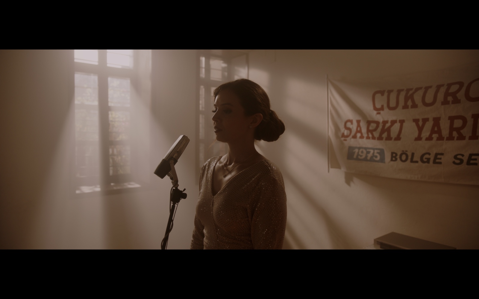 Radio Days — A singer at a microphone in warm shafts of window light.